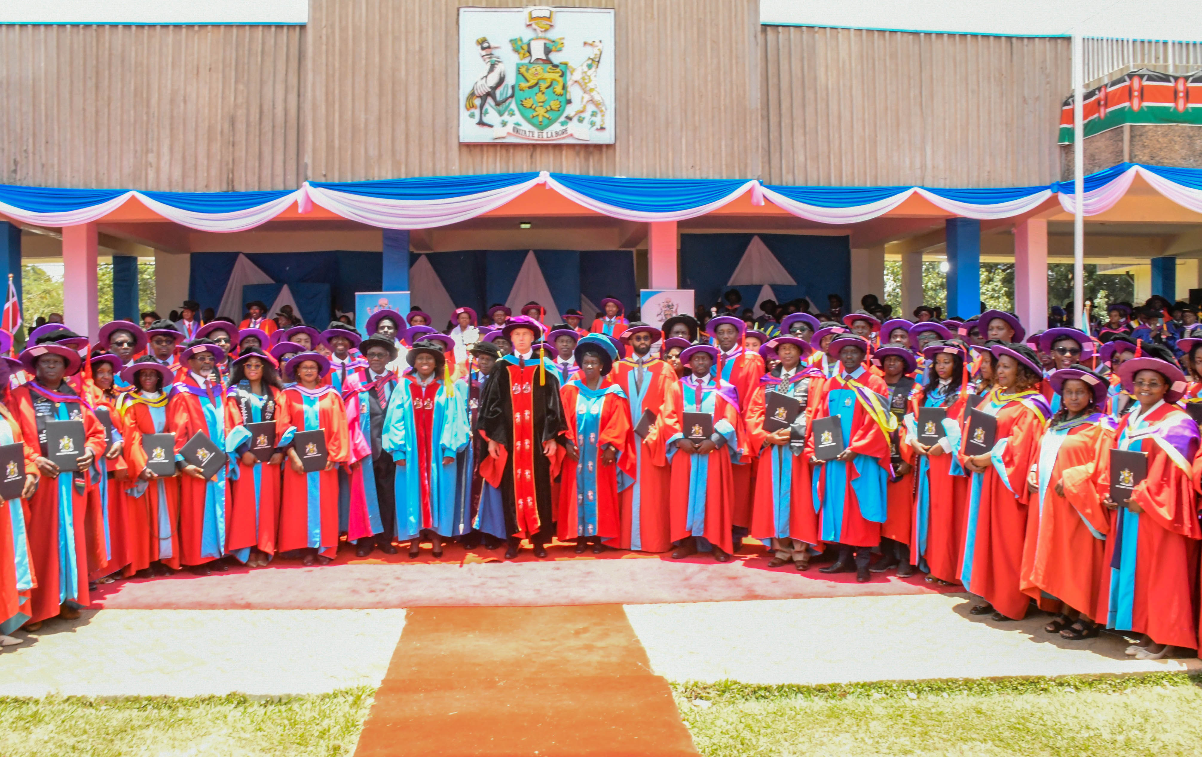 L-R: The Chair of Council, Prof Chacha Nyaigotti-Chaca, PS, Dr. Beatrice Inyangala, the Chancellor, Prof Patrick Verkooijen and the VC, Prof Margaret Hutchinson take a group photo with PhD graduands after the 73rd Graduation Ceremony.