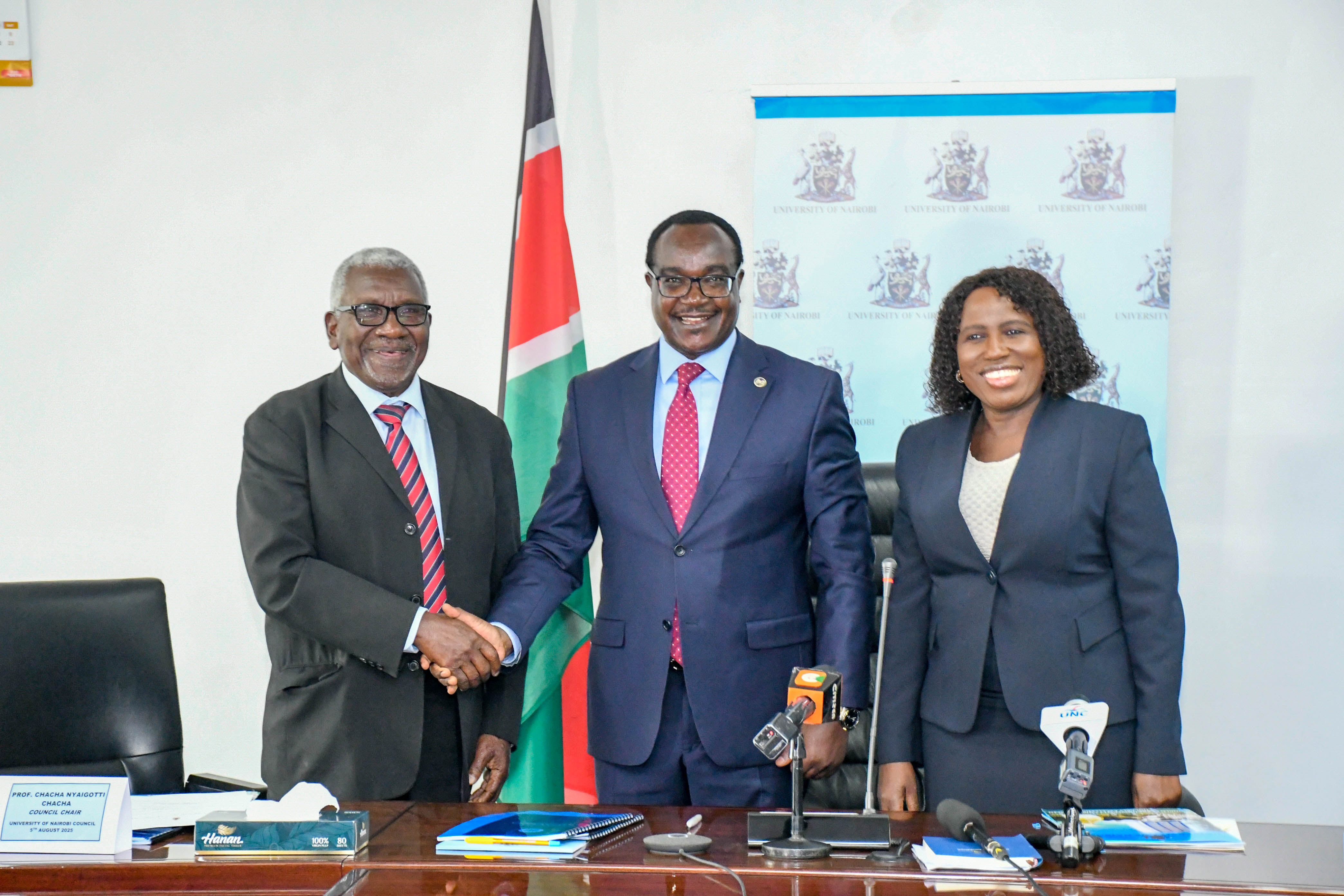 New Chair of Council, Prof Chacha Nyaigotti-Chacha is congratulated by Education CS, Hon Julius Ogamba together with the PS, Dr. Beatrice Inyangala.