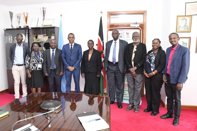 The VC (Ag) together with the Director General of NCPB take a group photo with other staff and guests.