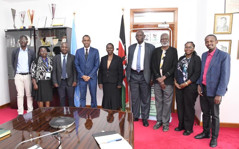 The VC (Ag) together with the Director General of NCPB take a group photo with other staff and guests.