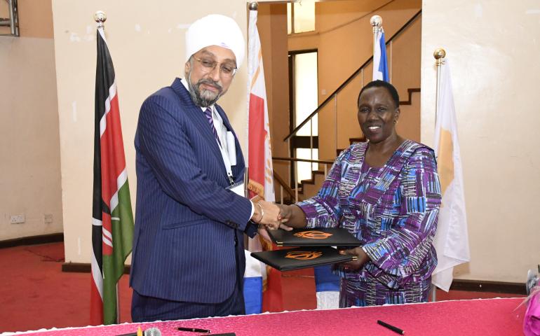 The Vice Chancellor (Ag), Prof Margaret Hutchinson and the Chairman of the Sikh Council of Africa, Mr. Jaswinder Singh Gharial exchange signed collaboration agreements.